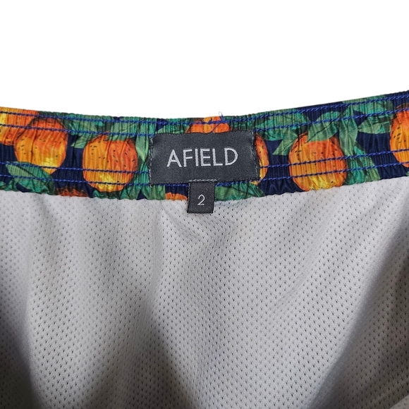 Vibrant Orange and Green Pineapple Swim Trunks - Picture 3 of 3